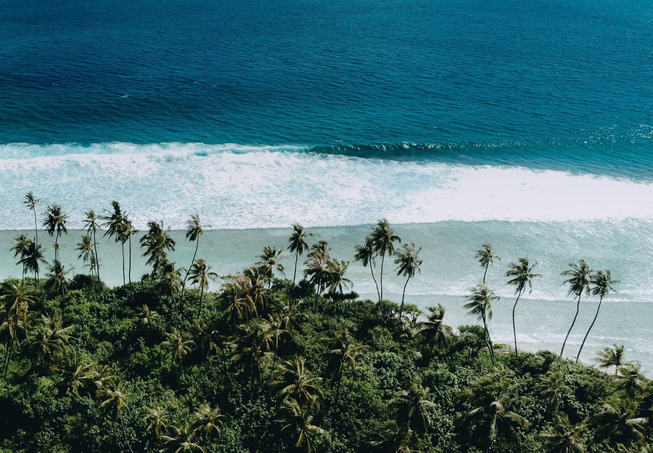 Turquoise lagoons and local Maldives islands